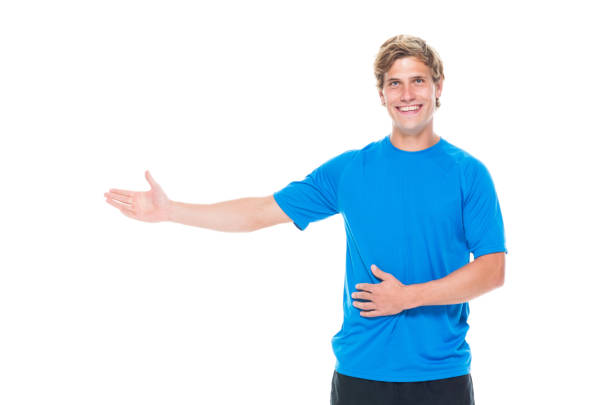 istock Handsome man in sports clothing presenting 1144807683