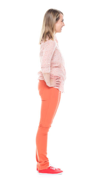 istock Good looking white female standing on white background - hands on hips 1144808625