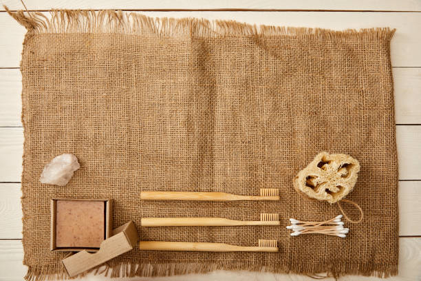 istock top view of various hygiene and care items arranged on canvas on white wooden surface, zero waste concept 1144812164