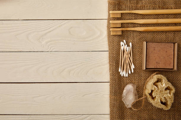 istock flat lay of various hygiene and care items arranged on sackcloth on white wooden surface, zero waste concept 1144812169