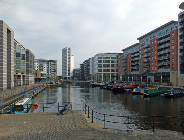 istock view along the clarence dock development in leeds with waterfront buildings reflected in the water boats and lock railings 1144813607