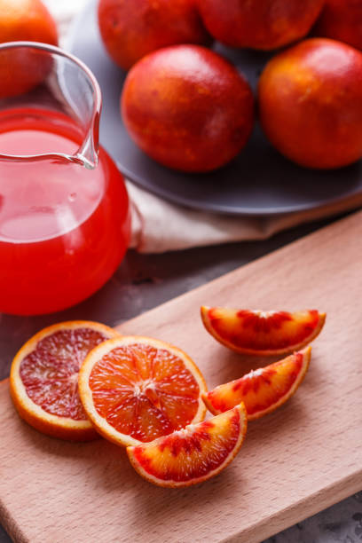 istock blood orange and juice on a dark background 1144813842