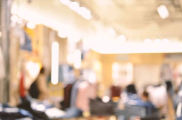 istock Abstract background - people shopping.  Clothes store. Blurry background 1144814052