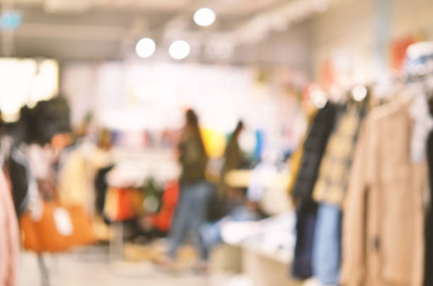 istock Abstract background - people shopping.  Clothes store. Blurry background 1144814073