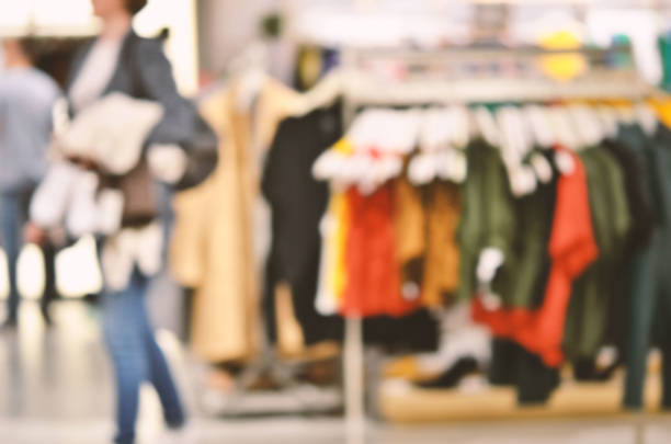 istock Abstract background - people shopping.  Clothes store. Blurry background 1144814104