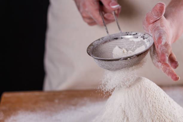 istock young woman squirting a flour in an apron 1144814313