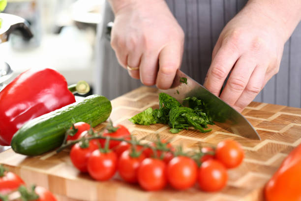 istock Male Hands Cutting Green Aromatic Sorrel Leaf 1144814430