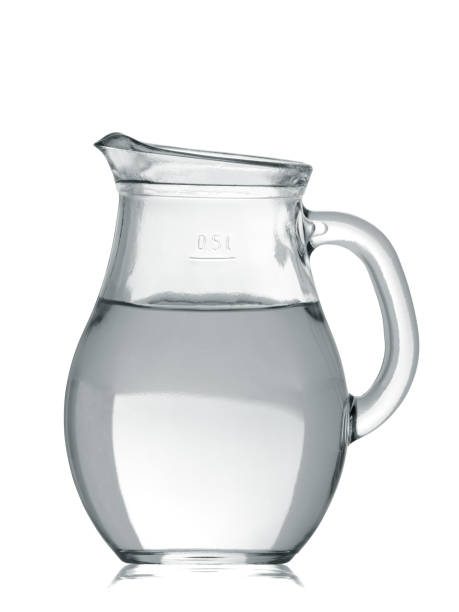 istock the glass jug filled with water with reflection isolated on a white background 1144815629