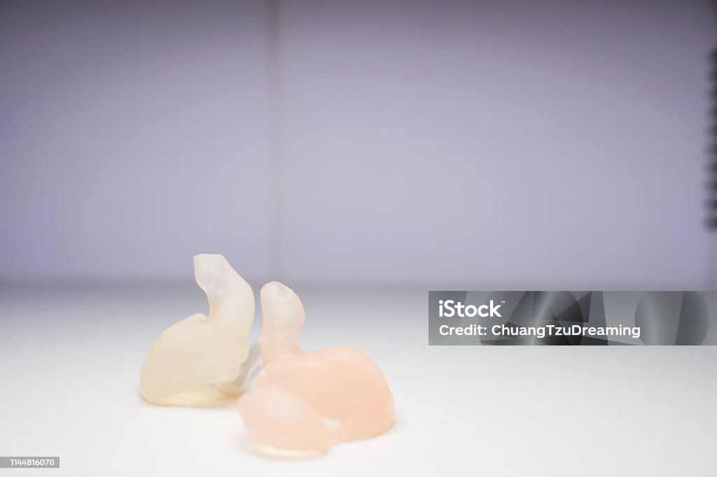 The Shell Mold used by the hearing aid. The material is silicone. Categories include Shell, Half Shell, Canal, Canal Lock, CIC, Skeleton, Open Fit. Imagery about medicine, hearing loss. AIDS Stock Photo