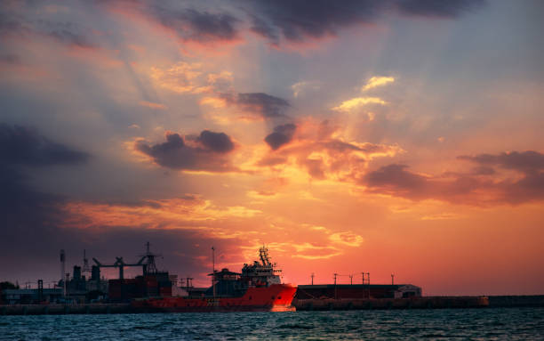 silhouette large public harbor in sunset hour at sea of thailand. - harbor editorial industrial ship container ship imagens e fotografias de stock