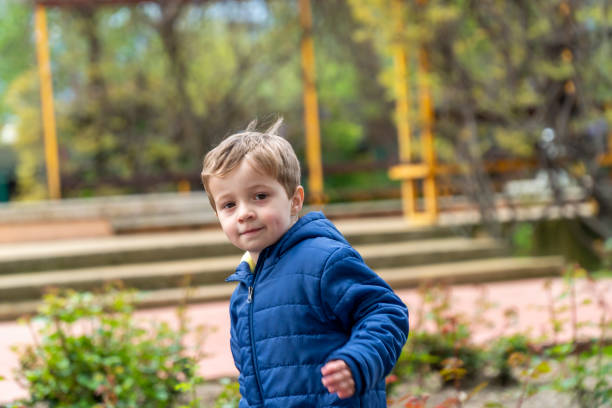 istock Small child running in a park 1144819479
