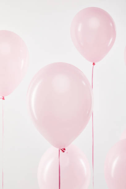 istock background with decorative pink air balloons isolated on white 1144820235