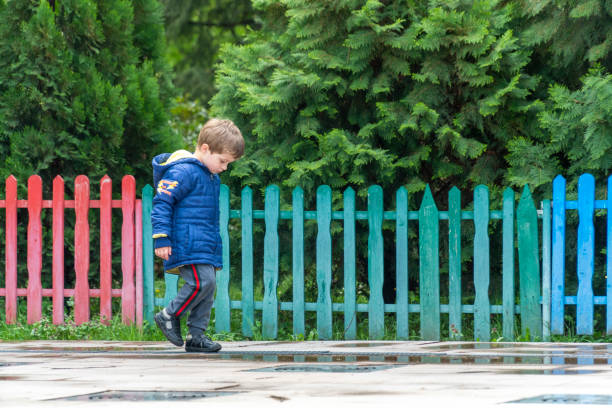 istock Small child walking and looking at his feet 1144820292