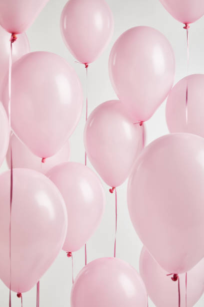 istock background with decorative pink balloons isolated on white 1144820316