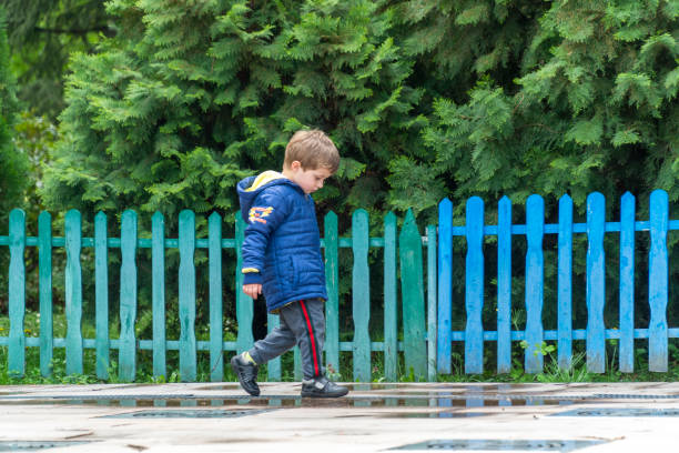 istock Small child walking and looking at his feet 1144820522