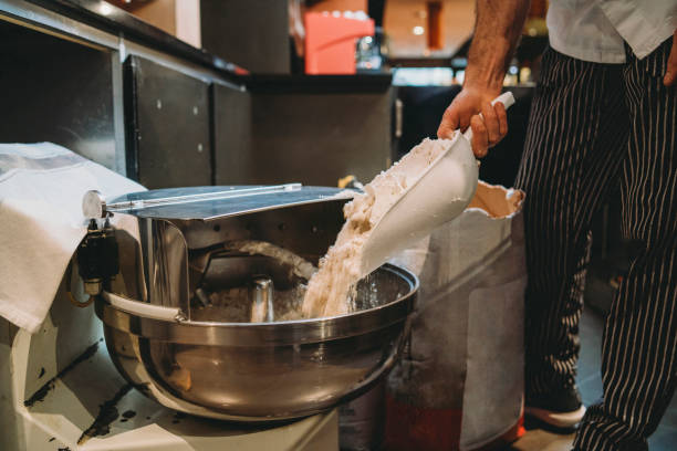 istock Pizza chef preparing the pizza dough with flour 1144820628