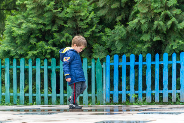 istock Small child walking and looking at his feet 1144820634