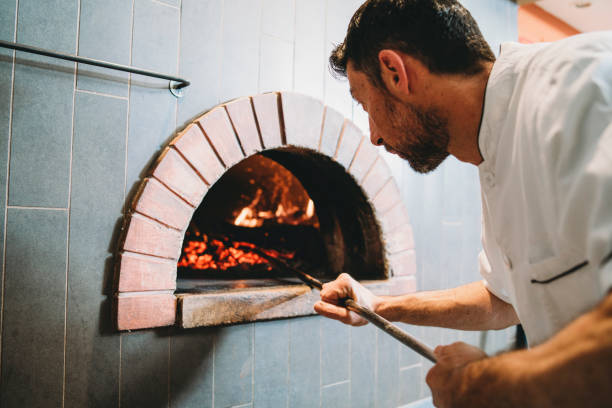 istock Pizza chef checking the oven of his pizzeria 1144820662