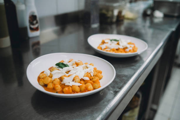 Gnocchi plates are ready in the restaurant's kitchen