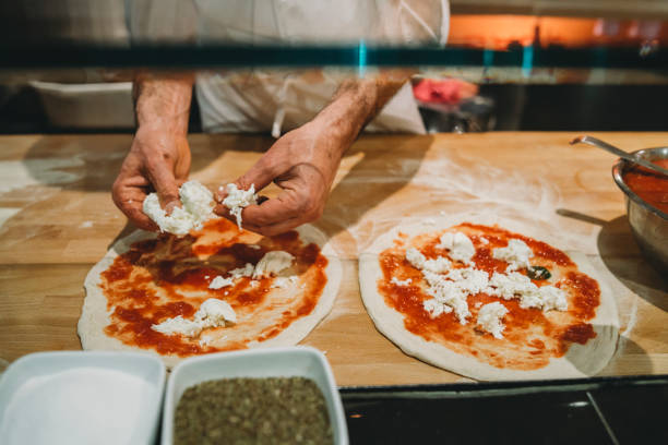 istock Pizza chef preparing a pizza at the restaurant 1144820741