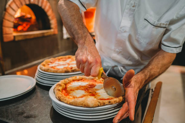 istock Pizza chef preparing pizza at the restaurant 1144820743