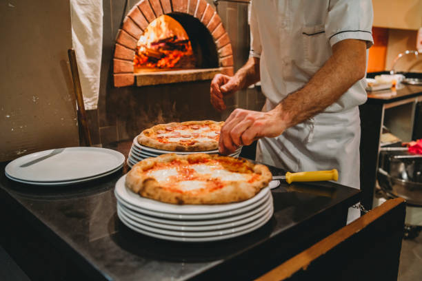 istock Pizza chef preparing pizza at the restaurant 1144820773