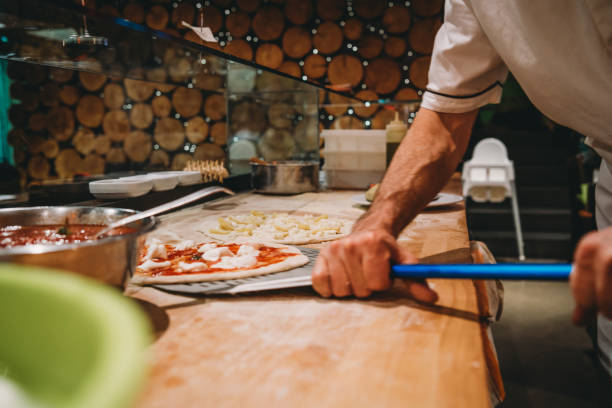 istock Pizza chef preparing a pizza at the restaurant 1144820791