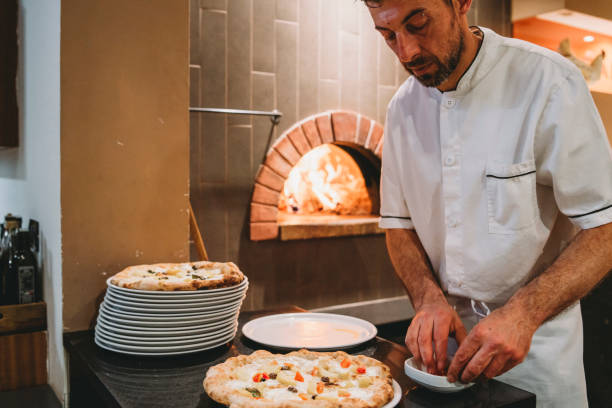 istock Pizza chef preparing pizza at the restaurant 1144820814