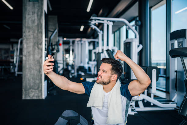 istock Strong young athletic man taking selfie after workout. 1144821297