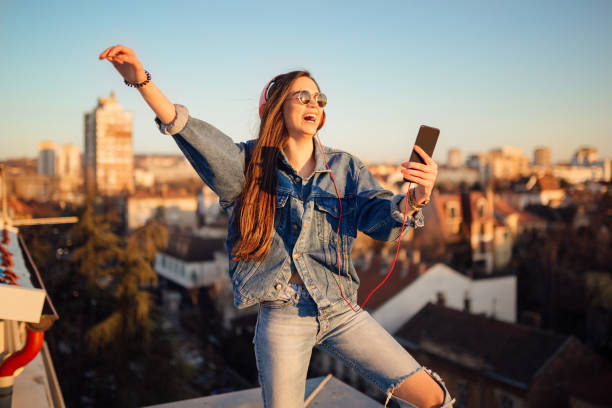 istock Young woman on the roof 1144822149