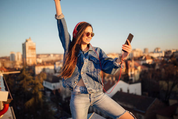 istock Young woman on the roof 1144822151