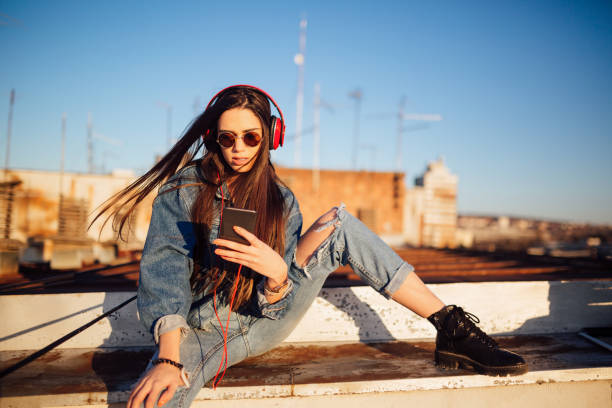 istock Young woman on the roof 1144822219