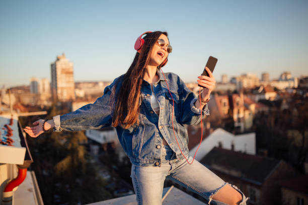 istock Young woman on the roof 1144822220