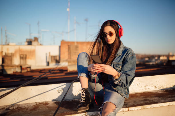 istock Young woman on the roof 1144822235