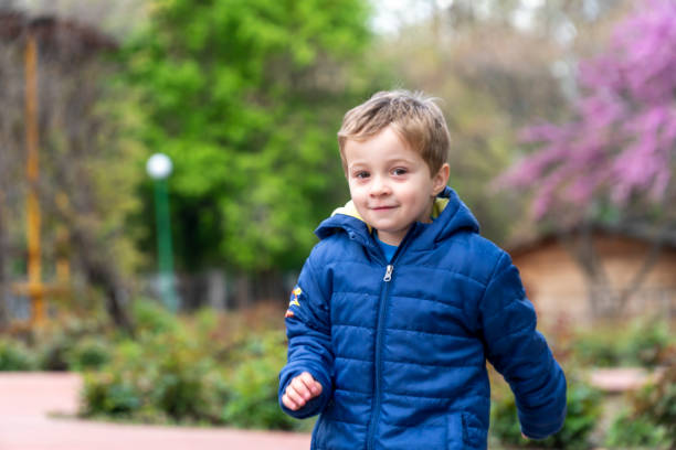 istock Small child running in a park 1144822647