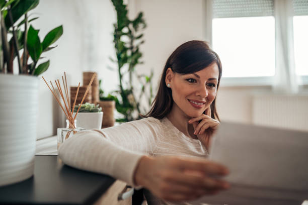 istock Beautiful woman reading a letter. 1144822671