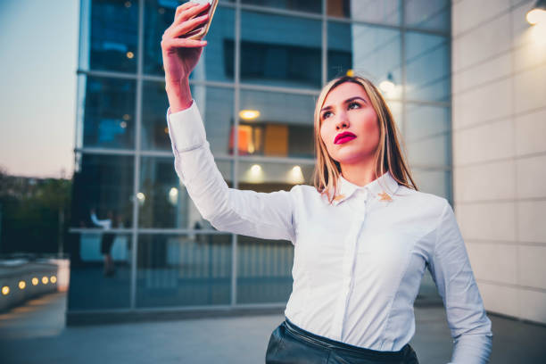 istock Young businesswoman taking selfie 1144822945