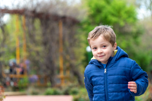 istock Small child running in a park 1144823304