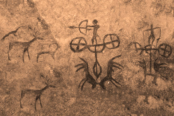 istock The image of ancient people and animals on the wall 1144823518