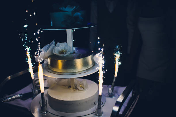 istock The wedding cake with fireworks stand on the table in restaurant. 1144824411