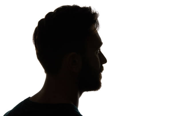 istock Silhouette of pensive man looking away isolated on white 1144824527