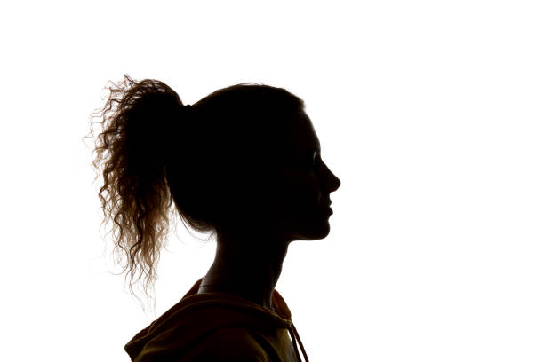 istock Side view of curly girl with ponytail isolated on white 1144824573