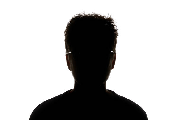 istock Silhouette of man in glasses looking at camera isolated on white 1144824583