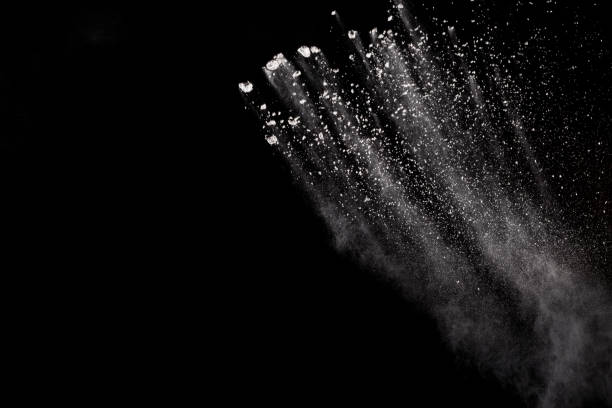 istock White powder explosion isolated on black background. White dust particles splash.Color Holi Festival. 1144824821
