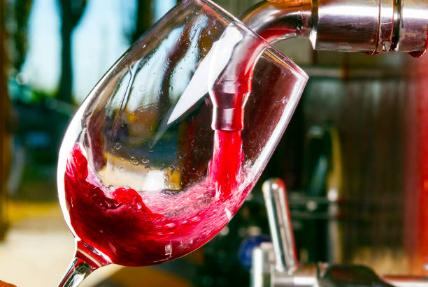 istock red wine glass barrel faucet 1144825401