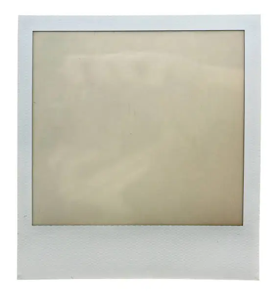 Photo of single empty or blank instant film frame or photo placeholder on real background