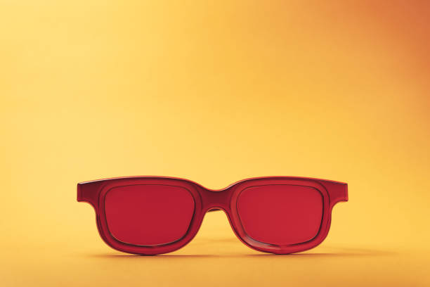 istock Red glasses on a orange table background. Summer concept. 1144830566