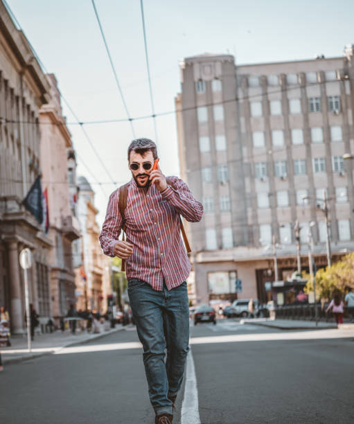 istock Young Man Walking on the City Road 1144830651