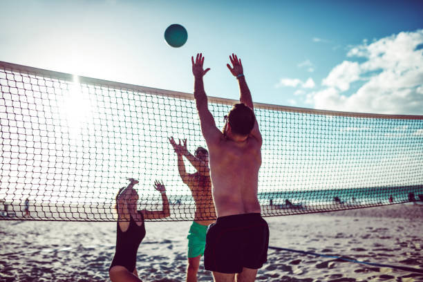 istock Happy People Playing Volleyball On Cuban Beach 1144831001