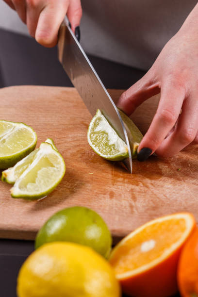 istock young woman in a gray aprons cut lime 1144831191